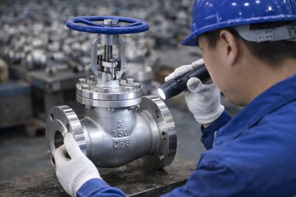 API globe valve visual inspection worker quality control industrial valve factory stainless steel globe valve inspection
