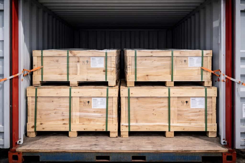 industrial gate valves loaded into shipping container in wooden crates for export
